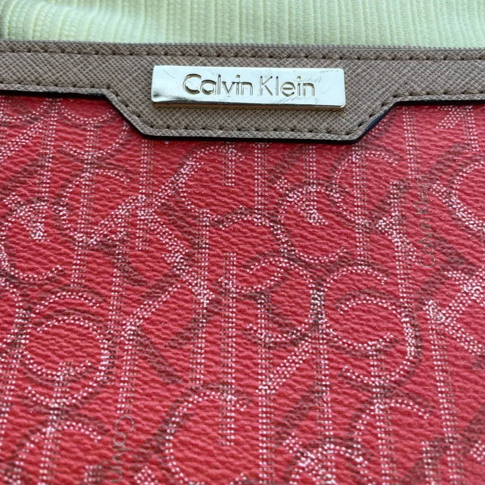 Calvin Klein Wristlet Women’s zipper coin purse 5x7‎ Orange W/Tan Trim w/CK logo